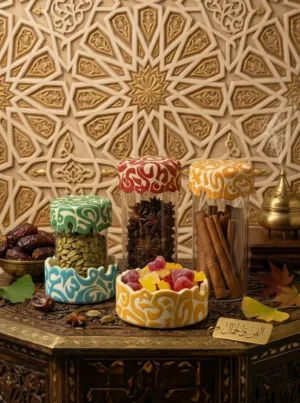 Glass containers with a decorated ceramic lid